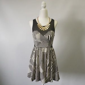 White and black design dress by Material Girl